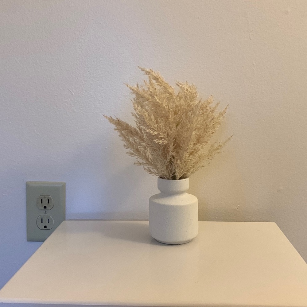 this is a fake plant with a textured vase